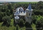 The beautiful old abandoned manor in the village of Pryozerne (Psary), Western Ukraine, aerial view